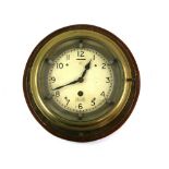 Mercer ships brass clock, enamelled dial with Arabic numerals and outer ring,. .