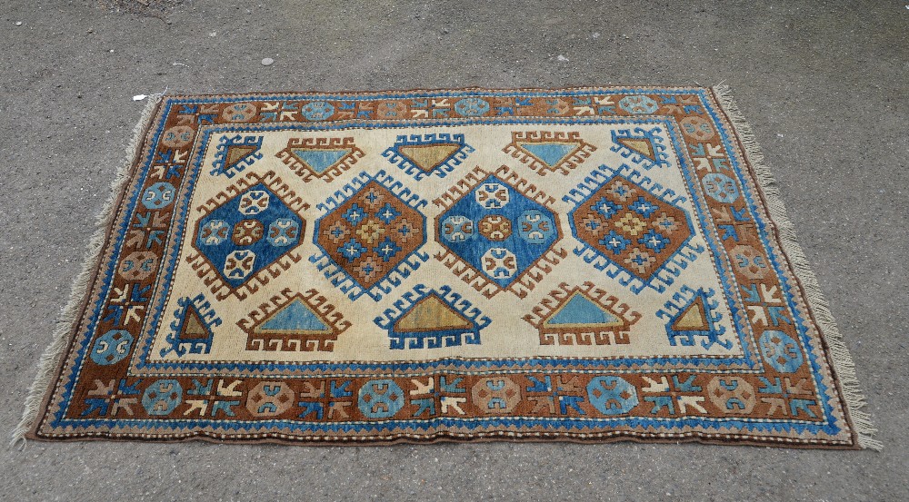Kazak cream ground rug 175cm x 129cm . .