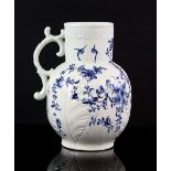 18th century English porcelain jug with underglaze blue floral pattern with birds, on moulded