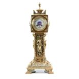 19th century moulded brass clock decorated with putti and scrolling foliage decoration, the white
