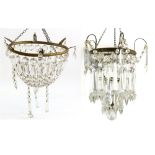 An early 20th century chandelier, with cut glass drops, and gilt-metal mounts, diam. 28cm, and