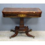 Regency rosewood card table with brass inlaid decoration on square column and quatrefoil base, 68.