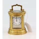 19th century bras and glass oval carriage clock with barrel movement, 10cm . .