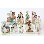 Fourteen 19th century and later Staffordshire figures figural groups and spill vases various