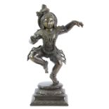§ A metal alloy figure of the dancing Lord Krishna, the Avatar of Vishnu and the Hindu Deity of