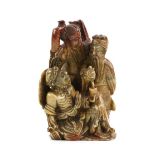 A mottled soapstone group carved as a parody of The Three Vinegar Tasters, Confucius, Buddha and