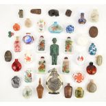 Thirty various Chinese snuff bottles [or other, similar small vessels], variously decorated with