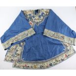 A Chinese blue-ground textile tunic with white ground collar and cuffs; from collar to hem about