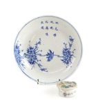 A Chinese blue and white dish, decorated with a bird on plum blossom beneath a three-line poem,