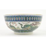 A famille rose bowl, decorated on the exterior with two long-tailed birds beside a large prunus