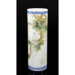 A polychrome porcelain bitong of cylindrical form; decorated with a pair of birds perched in a tree;