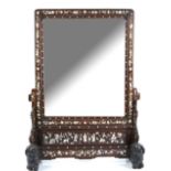 A Vietnamese, or other Asian, wood mounted mirror; the stand designed with recumbent Buddhistic