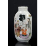 A famille rose Chinese snuff bottle, decorated with three figures on a garden verandah beside
