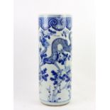 A blue and white stick stand of typical cylindrical form, decorated with bold designs of confronting