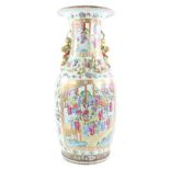 A large Canton famille rose vase with trumpet neck, decorated with typical panels of Manchu/