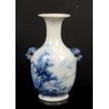 REVISED ESTIMATE: A small blue and white vase with trumpet neck and animal head handles,