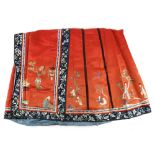 A Tomato-Red ground Chinese textile skirt, decorated with designs of boys and scholar's