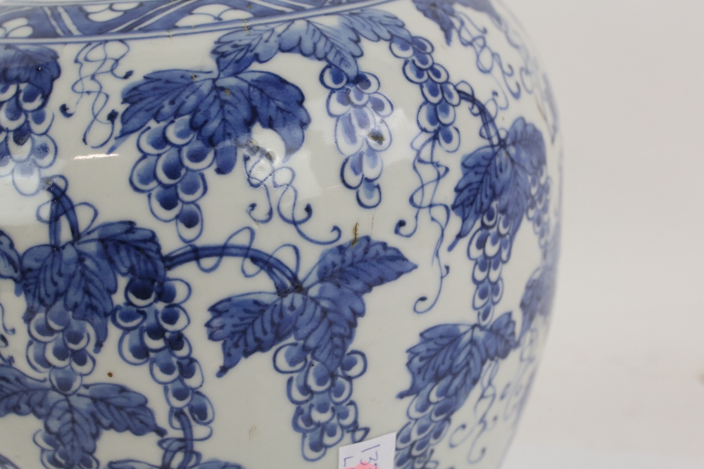 A blue and white vase with unglazed base, decorated with fruiting vine, 24 cm high; together with - Image 26 of 27