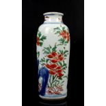 A small Transitional sleeve vase with unglazed base; decorated with orange-red flowers, green