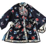 A Chinese silk lady's robe with a design of vessels flowers and insects, panels finely embroidered