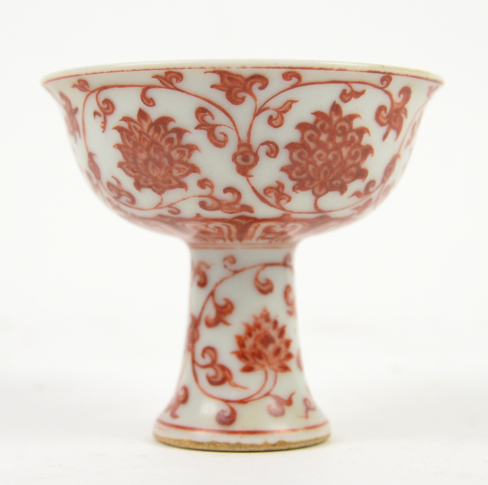 An orange decorated stem cup, decorated on the top centre with Xuande six-character mark, but not of