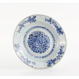A blue and white Chinese Export plate, decorated with floral designs, 22.5 cm diameter, Qianlong. No