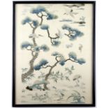 A Chinese silk panel embroidered with The Daoist theme of Cranes, flying through pine trees,