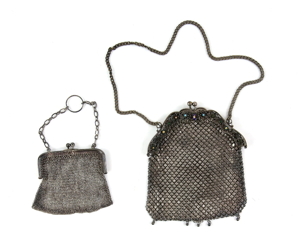 A silver mesh purse and another in plate with paste stones and enamel stones.