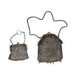 A silver mesh purse and another in plate with paste stones and enamel stones.