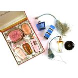 A Gucci compact, two Art Deco atomisers with silk tassels one Regent of London, and a Helena