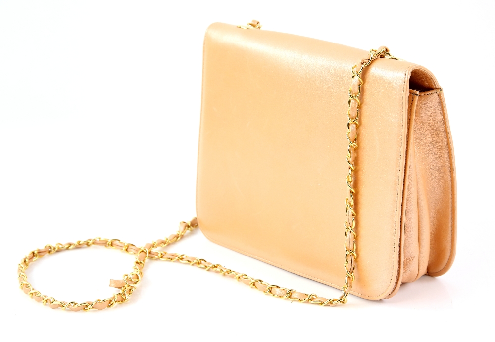 Bruno Magli peach coloured handbag with gold chain shoulder handle with dust bag and a red holdall.