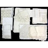 A quantity of table linen, mainly white and a lace bed clothes cover, and a Herbert Johnson black