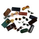 Collection of 11 pairs of vintage sunglasses 1930s and 1980s some in cases . The sunglasses are