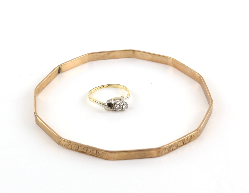 Three stone diamond ring, in 18 ct gold, centre stone estimated at 0.25 carat, ring size L and a