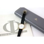 Baume Mercier a Gentleman's reference 15172 gold dress watch , the circular white enamel dial with