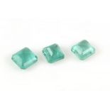 Three loose rectangular step cut emeralds, estimated weights 2.24 carats, 2.11 carats and 1.87