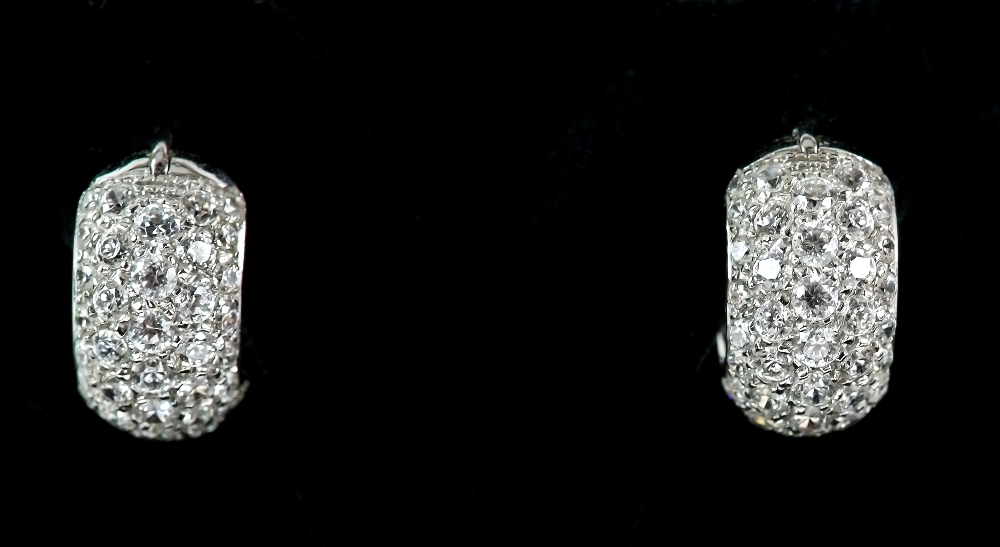 A pair of cubic zirconia pave set hoops, hinge clip fittings, mounted in 18 ct. CONDITION18 ct gross