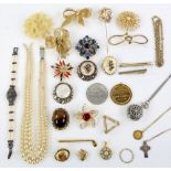 A group of costume jewellery, including faux pearls, brooches, silver chain and cross pendant,