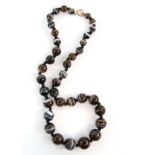 A banded agate bead necklace strung with knots to a bolt ring clasp, length 40 cm . CONDITION, a few