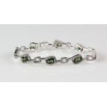 Contemporary green tourmaline and diamond bracelet; eight rectangular faceted tourmalines