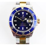 A Rolex Submariner gentleman’s automatic wristwatch, stainless steel case, the rotating blue ceramic