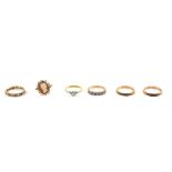 Six vintage gold rings, solitaire diamond, mount stamped 18 ct and platinum, half eternity ring