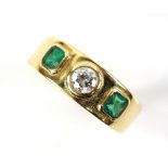 Emerald and diamond three stone ring, centrally set with transitional cut diamond, estimated total