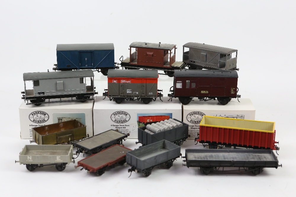 Fourteen O gauge assembled kit-built wagons, one part assembled, one unassembled and three