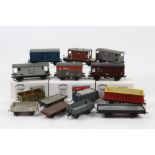 Fourteen O gauge assembled kit-built wagons, one part assembled, one unassembled and three