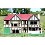 Tudor style dolls house with dolls house furniture, 63cm x 114cm x 44cm,