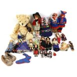 Modern 'Henry' teddy bear, and a collection of porcelain, plastic, cloth and other dolls from around