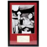 Boxing - Muhammad Ali (1942-2016) Signed autograph card from the 1970's mounted with photo,