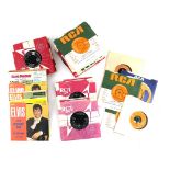 Elvis memorabilia including quantity of 45rpm 7 inch singles, promotional material, clothing,