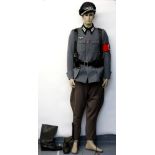 German military costume comprising of jacket, trousers, boots and cap. This costume would have